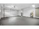 Spacious two car garage with concrete flooring at 3013 E 7Th St, Anderson, IN 46012