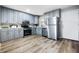 Well-lit kitchen featuring shaker cabinets, stainless steel appliances and sleek countertops at 3013 E 7Th St, Anderson, IN 46012