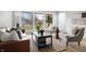 Bright living room featuring hardwood floors, a large window, and modern furnishings at 3013 E 7Th St, Anderson, IN 46012