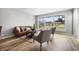 Bright living room featuring hardwood floors, a large window, and modern furnishings at 3013 E 7Th St, Anderson, IN 46012