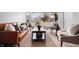 Bright living room featuring hardwood floors, a large window, and modern furnishings at 3013 E 7Th St, Anderson, IN 46012
