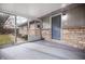 Covered patio with brick accents providing outdoor living space at 3013 E 7Th St, Anderson, IN 46012