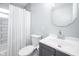 Updated bathroom featuring a shower and tub combination and a grey vanity and matching mirror at 3045 N Lasalle St, Indianapolis, IN 46218