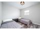 Bright bedroom with two twin beds and matching storage drawers for a neat and tidy space at 3045 N Lasalle St, Indianapolis, IN 46218