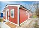 Charming home featuring a red exterior, white trim, and a well-maintained yard at 3045 N Lasalle St, Indianapolis, IN 46218