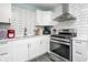 Bright kitchen features stainless steel appliances, white cabinets, and modern backsplash at 3045 N Lasalle St, Indianapolis, IN 46218