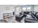 Cozy living room with stylish flooring and a large comfortable sofa at 3045 N Lasalle St, Indianapolis, IN 46218