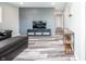 Bright living room boasts modern flooring and a contemporary accent wall at 3045 N Lasalle St, Indianapolis, IN 46218