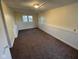 Finished basement area with carpet, neutral paint, and a small window providing natural light at 318 Tague St, Greenfield, IN 46140
