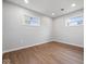 Unfurnished bedroom with newly refinished hardwood floors and modern lighting at 329 Roosevelt Dr, Shelbyville, IN 46176