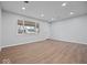 Spacious living room with new hardwood floors, neutral walls, and ample natural light at 329 Roosevelt Dr, Shelbyville, IN 46176