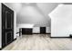 Spacious finished attic featuring new flooring, modern trim, and freshly painted walls at 425 E Walnut St, Indianapolis, IN 46202