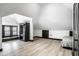 Spacious attic room with natural light, vinyl flooring, and ample storage for a versatile living space at 425 E Walnut St, Indianapolis, IN 46202
