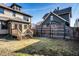 View of the grassy yard and tiered wooden deck that extends from the home's back entrance at 425 E Walnut St, Indianapolis, IN 46202