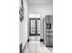 Bright kitchen featuring stainless steel refrigerator and view of exterior at 425 E Walnut St, Indianapolis, IN 46202