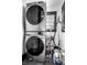 Compact laundry room featuring modern stacked washer and dryer for efficient space saving at 425 E Walnut St, Indianapolis, IN 46202