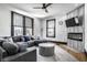 Comfortable living room featuring modern furniture, a fireplace, and large windows for ample light at 425 E Walnut St, Indianapolis, IN 46202