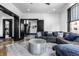Inviting living room featuring a comfortable gray sectional sofa and stylish decor throughout at 425 E Walnut St, Indianapolis, IN 46202