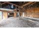 This rustic barn features exposed beams, wooden walls, and a workbench, creating a unique workshop space at 4610 W 72Nd St, Indianapolis, IN 46268