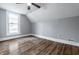 Attic bedroom featuring hardwood floors, neutral walls, a ceiling fan and a dormer window at 4610 W 72Nd St, Indianapolis, IN 46268