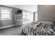 Well-lit bedroom boasts a dresser and large windows, providing ample natural light and street views at 4610 W 72Nd St, Indianapolis, IN 46268