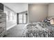 Spacious bedroom with carpet features a modern dresser and access to outdoor views at 4610 W 72Nd St, Indianapolis, IN 46268