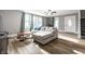 Well-lit living room includes stylish wood floors, a plush couch and large, bright windows at 4610 W 72Nd St, Indianapolis, IN 46268