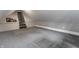 Attic room featuring gray carpet, neutral walls and staircase leading to another room at 4610 W 72Nd St, Indianapolis, IN 46268