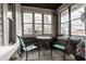 Relaxing sunroom featuring exposed brick and large windows with a patio set at 4610 W 72Nd St, Indianapolis, IN 46268