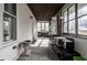 The sunroom features large windows with views of the yard and patio furnishings at 4610 W 72Nd St, Indianapolis, IN 46268