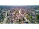 Picturesque aerial view of a community featuring varied homes along tree-covered streets in a suburban setting at 5937 Guilford Ave, Indianapolis, IN 46220