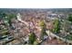 An aerial shot shows a neighborhood with a mix of homes, mature trees, and quiet residential streets at 5937 Guilford Ave, Indianapolis, IN 46220