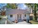 Backyard with patio, white siding, a well-maintained lawn, French doors and a gas grill at 5937 Guilford Ave, Indianapolis, IN 46220