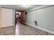 Basement featuring wood-look floors and rustic wood door to storage room at 5937 Guilford Ave, Indianapolis, IN 46220