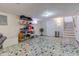 Finished basement with unique mosaic tile flooring and ample storage shelving at 5937 Guilford Ave, Indianapolis, IN 46220