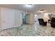 Finished basement featuring mosaic tile flooring, neutral walls, and a view of an adjoining room at 5937 Guilford Ave, Indianapolis, IN 46220