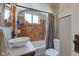 Updated bathroom featuring vessel sink, bathtub, and unique tile work at 5937 Guilford Ave, Indianapolis, IN 46220