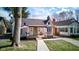 Charming home showcasing a well-manicured front lawn, inviting porch, and classic architectural details at 5937 Guilford Ave, Indianapolis, IN 46220