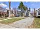 Charming home with a gravel driveway, a covered front porch, and a well-maintained lawn at 5937 Guilford Ave, Indianapolis, IN 46220