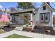 Charming home boasting a cozy front porch with a swing and seating area at 5937 Guilford Ave, Indianapolis, IN 46220