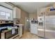 Well-lit kitchen features stainless steel appliances and ample cabinet space at 5937 Guilford Ave, Indianapolis, IN 46220