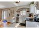 Well-appointed kitchen featuring bright countertops, stainless steel dishwasher, and a versatile rolling cabinet at 5937 Guilford Ave, Indianapolis, IN 46220