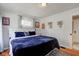 Comfortable bedroom with hardwood floors and natural light at 5937 Guilford Ave, Indianapolis, IN 46220