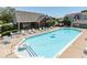 Refreshing community pool with lounge chairs for relaxing and enjoying the outdoors on a sunny day at 6231 Amber Creek Ln # 312, Indianapolis, IN 46237