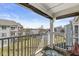 Balcony with railings overlooking a grassy lawn and neighboring houses at 6231 Amber Creek Ln, Indianapolis, IN 46237