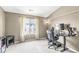 A neutral toned bedroom featuring a window providing natural light, and a ceiling fan at 6231 Amber Creek Ln, Indianapolis, IN 46237