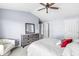 Spacious bedroom with vaulted ceilings, a ceiling fan and plush carpeting at 6231 Amber Creek Ln, Indianapolis, IN 46237