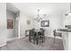 Cozy dining area featuring modern chandelier lighting, a table set, and a small bar area at 6231 Amber Creek Ln, Indianapolis, IN 46237