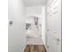 Bright hallway leading to an open living area, showcasing a modern thermostat and tasteful decor at 6231 Amber Creek Ln, Indianapolis, IN 46237