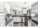 Well-lit kitchen with stainless steel appliances and access to open-concept living area at 6231 Amber Creek Ln, Indianapolis, IN 46237